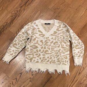 Chic Leopard V-Neck Sweater with Frayed Hem